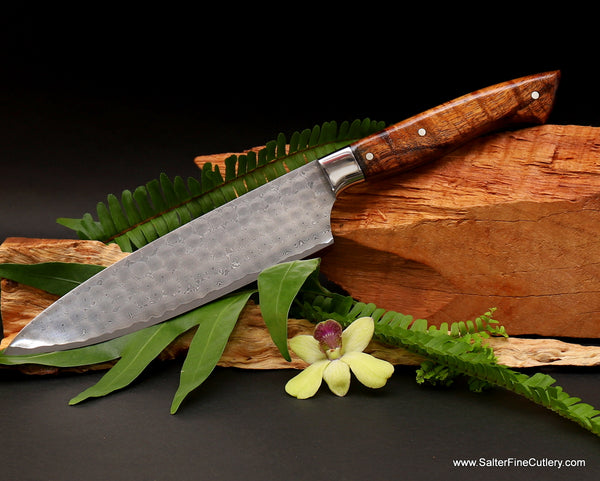 https://salterfinecutlery.com/cdn/shop/articles/210mm_chef_knife_N-series_whirlpool_handmade_damascus_pattern_with_curly_koa_handle_and_stainless_steel_bolster_from_Salter_Fine_Cutlery_600x481.jpg?v=1701917427