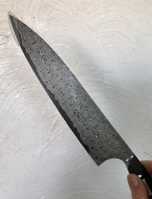 240mm Charybdis series blade with hand-forged whirlpool damascus finish made exclusively for Salter Fine Cutlery in Japan