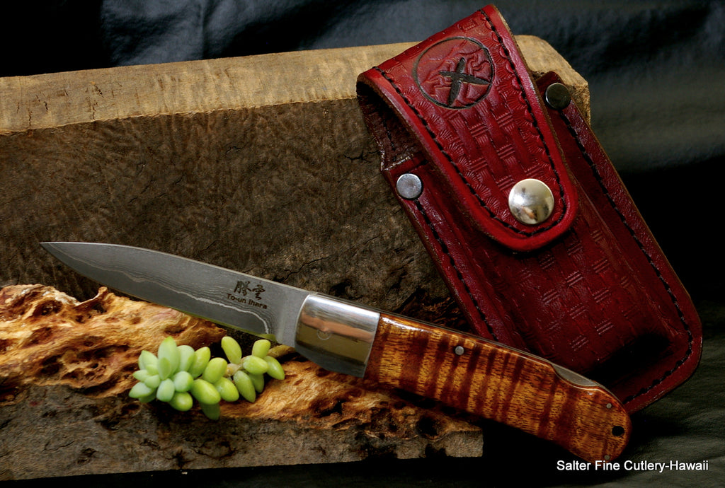 Handmade folding knife with koa wood handle and Japanese handmade blade includes custom lined leather belt sheath