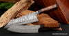 Pieces from our VillageForge collection of luxury chef knives hand-forged 210mm butcher knife and 180mm meat and vegetable knife handcrafted from Salter Fine Cutlery 