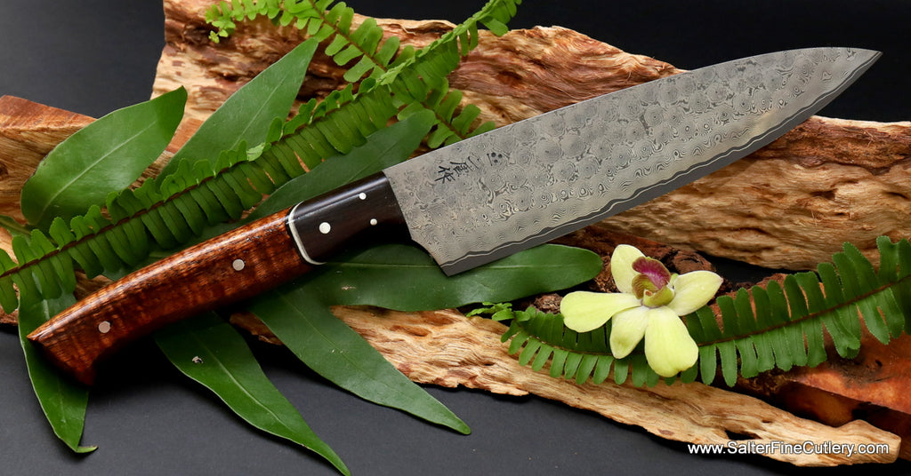 Beautiful luxury kitchen knife hand-forged whirlpool damascus pattern with curly koa and ebony bolster from Salter Fine Cutlery