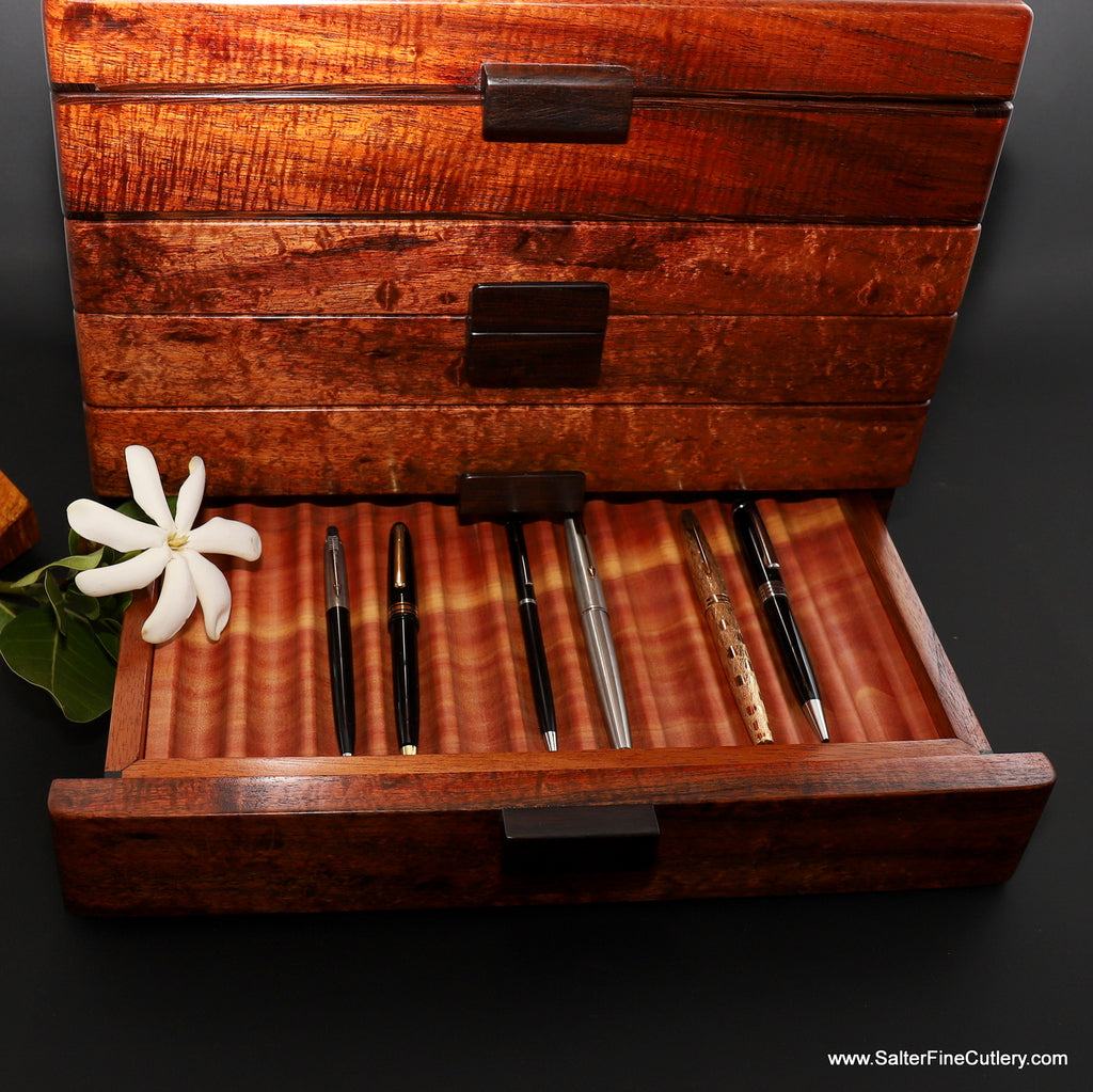 Handcrafted Hawaiian curly koa wood pen box with one drawer open by Salter Fine Cutlery custom woodworking