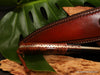 Detail view of custom hand filed tang on hunting knife from Salter Fine Cutlery  collectible knives made in Hawaii with curly koa wood handle
