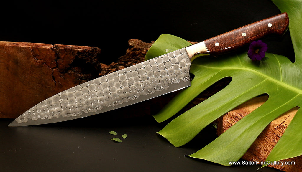 https://salterfinecutlery.com/cdn/shop/products/240mm_chef_knife_Charybdis_full-tang_3-metal_mokume_bolster_and_curly_koa_handle_by_Salter_Fine_Cutlery_of_Hawaii_1024x585.jpg?v=1658963795