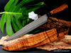 270mm Carving knife from our Charybdis collectible design series with curly Hawaiian koa wood handle and matching storage sheath by Salter Fine Cutlery