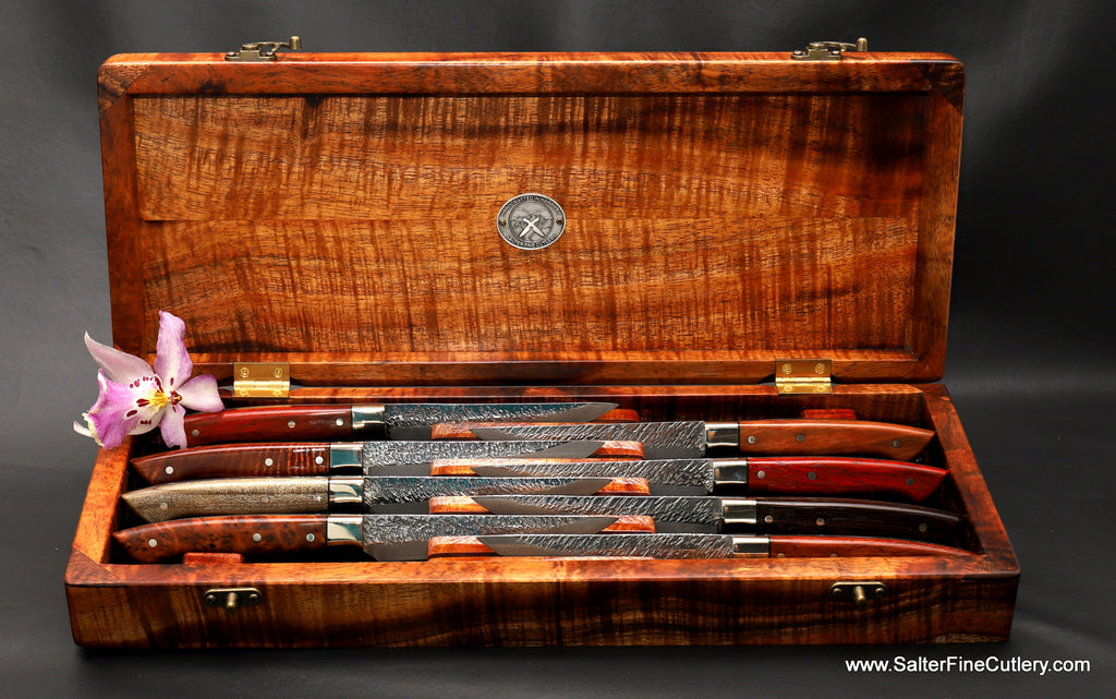 Presentation box curly koa wood to hold an 8-piece custom Raptor steak knife set in our new staggered display handcrafted by Salter Fine Cutlery of Hawaii