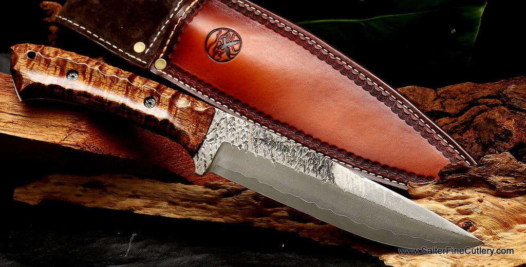 https://salterfinecutlery.com/cdn/shop/products/Hunting_knife_with_exclusive_combination_raptor_and_river_pattern_blade_and_scalloped_blade_handcrafted_by_Salter_Fine_Cutlery_of_Hawaii_9b627e86-e177-415a-a872-9383bc6859c7_1024x521.jpg?v=1646424427