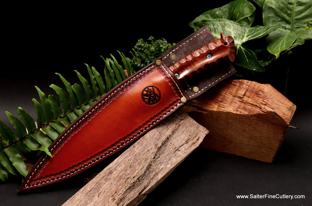 Hunting knife with scalloped handle in a Salter Fine Cutlery handmade pigskin lined leather belt sheath with flap available in a choice of color options